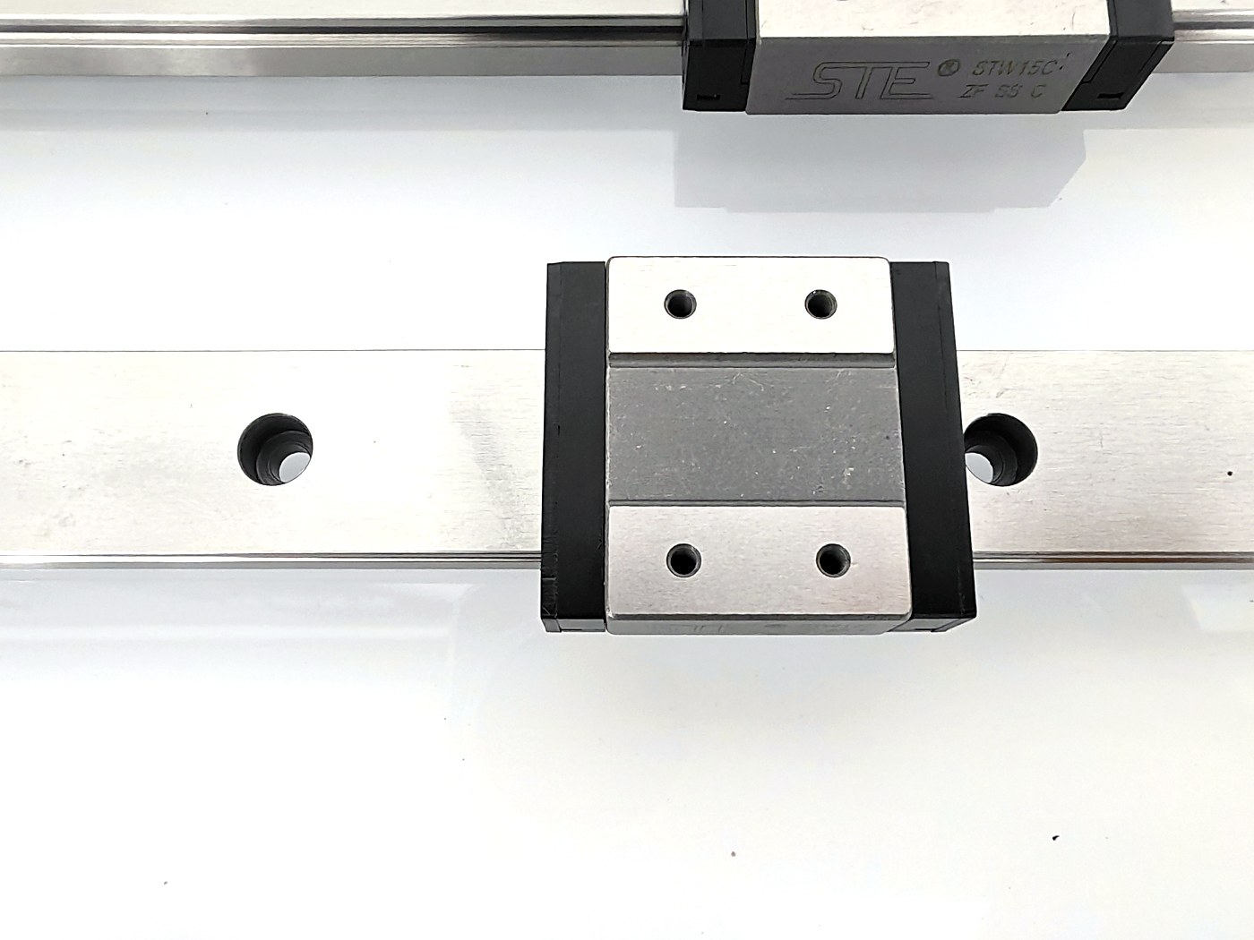 DDJ SMT self-lubricating miniature linear guide carriage with seals — real product photo